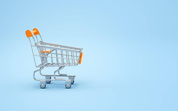 istock Empty Orange Plastic Colorful Metallic Shopping Cart on Soft Light Blue Endless Background 2217465766
