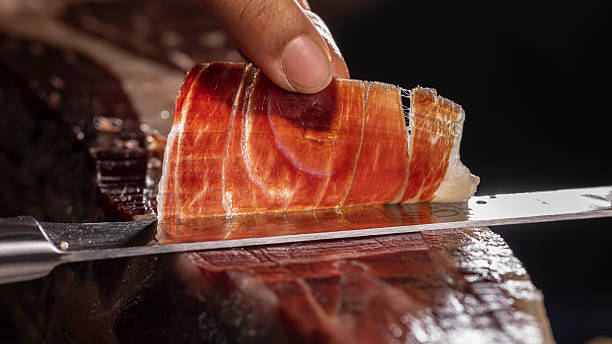 istock Traditional Iberian ham from Spain cut with a knife 2217469684