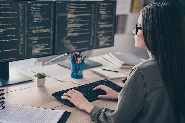 istock Profile side view portrait of attractive focused qualified girl geek improving task issue web development at workplace workstation indoors 2217470557