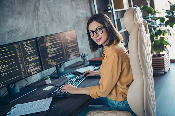 istock Profile side view portrait of attractive cheery girl expert developing operating system html css at workplace workstation indoors 2217470562