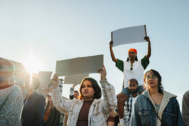 istock Group of activists holding blank signs during a protest on a sunny day 2217471453