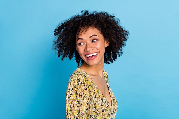 istock Photo of shiny charming lady dressed print outfit smiling looking back empty space isolated blue color background 2217473593