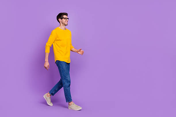 istock Full size profile side photo of young handsome man go on walk loo empty space isolated on violet color background 2217475065