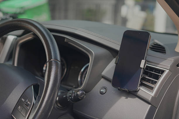 istock Playing with your phone while driving in a car can cause accidents. 2217475212