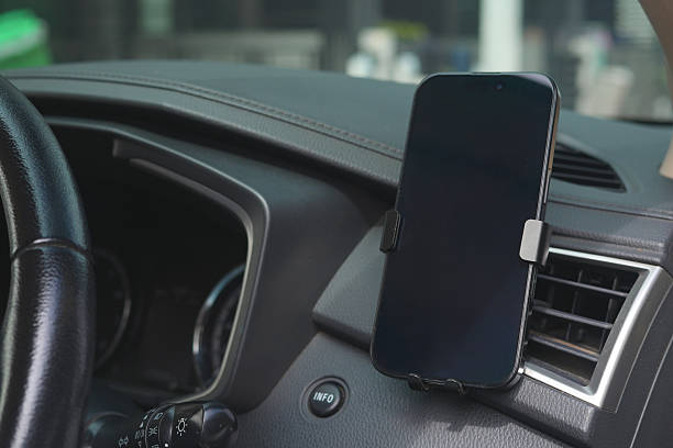 istock Playing with your phone while driving in a car can cause accidents. 2217475312
