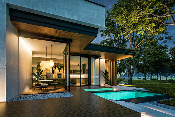 istock 3d rendering of two-story house with concrete facade in night 2217479250