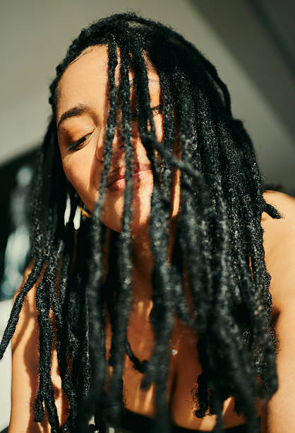 istock Confident Woman with Long Black Dreadlocks 2217480029