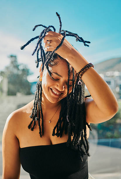 istock Smiling Young Woman with Long Dreadlocks 2217480039