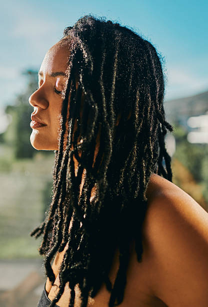 istock Profile Of Woman With Sunlit Dreadlocks 2217480062