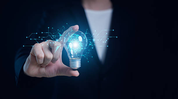 istock Hand of  holding illuminated light bulb, Idea innovation and inspiration concept.  creativity with bulbs that shine glitter, Concept for success. 2217480334