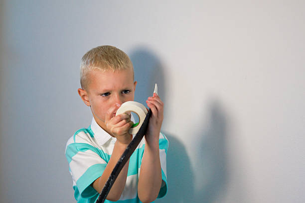 istock Boy taping his ice hockey stick 2217480719