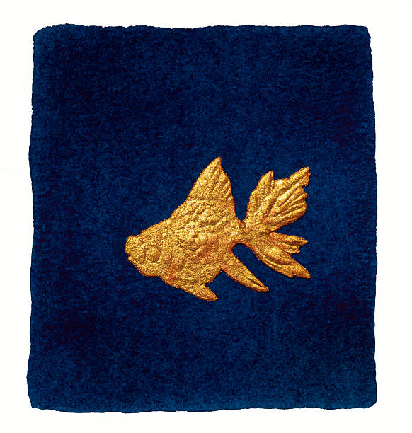 gold colored paper fish on blue background painted in watercolor