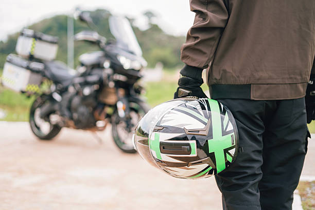 istock Biker helmet and motorcycle in blur background 2217484447