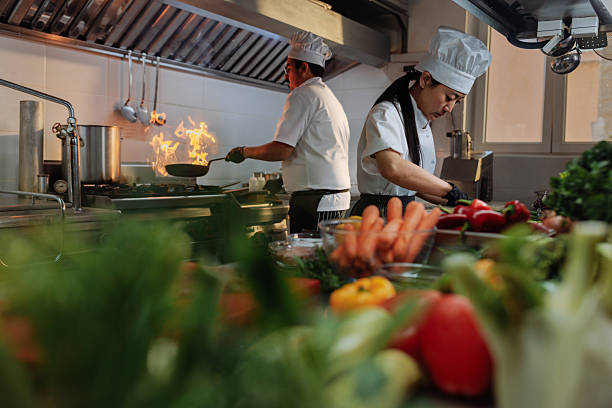 istock Chefs preparing food in restaurant kitchen 2217486834