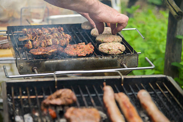 Grilled German-Style Patties and Meat on a Charcoal Barbecue