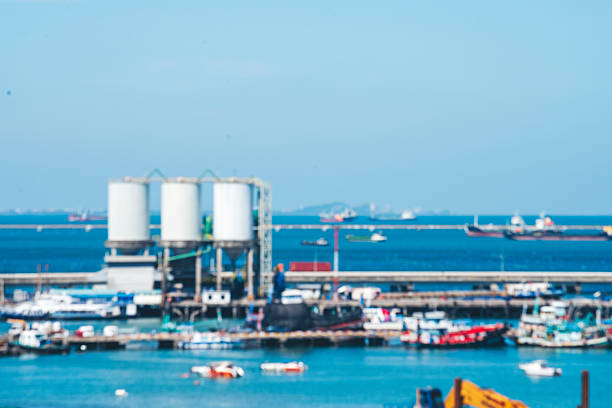 Logistic shipping quay boat Engineering crane depot at logistic export terminal control. Warehouse freight background container yard loading quayside harbor port. Logistics seascape shipping portal