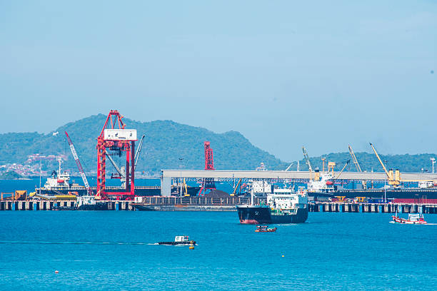 istock Logistic shipping quay boat Engineering crane depot at logistic export terminal control. Warehouse freight background container yard loading quayside harbor port. Logistics seascape shipping portal 2217487423