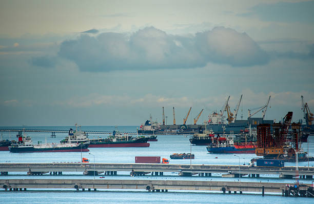 ships in a cargo port on a cloudy day