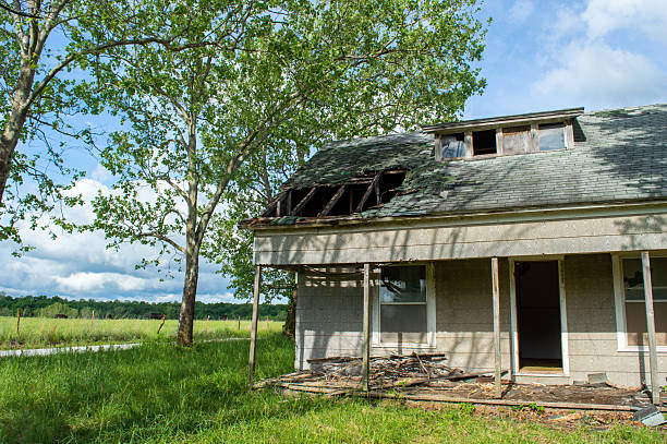 istock Abandoned grey decayed house with colorful landscape 2217487918