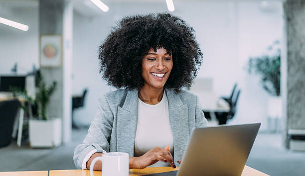 istock Successful businesswoman in modern office working on laptop. 2217491649