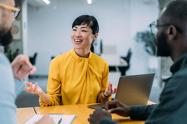 istock Group of business persons talking in the office. 2217491653