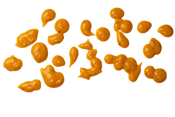 istock Yellow sauce splashes as a background. 2217492114