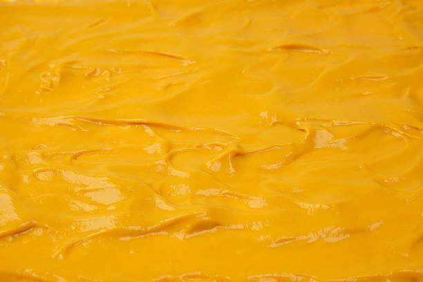 istock Yellow sauce splashes as a background. 2217492126