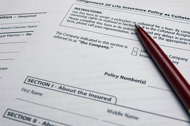 istock Insurance documents ready to be signed. Ball-point pen, printed papers. 2217492443