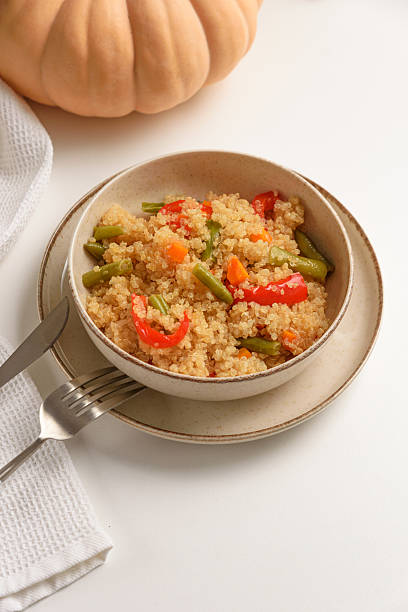 istock Healthy quinoa bowl with vegetables and pumpkin. 2217493478