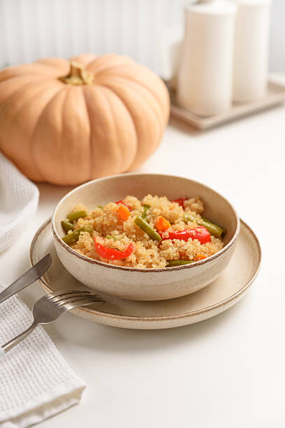 istock Healthy quinoa bowl with vegetables and pumpkin. 2217493479