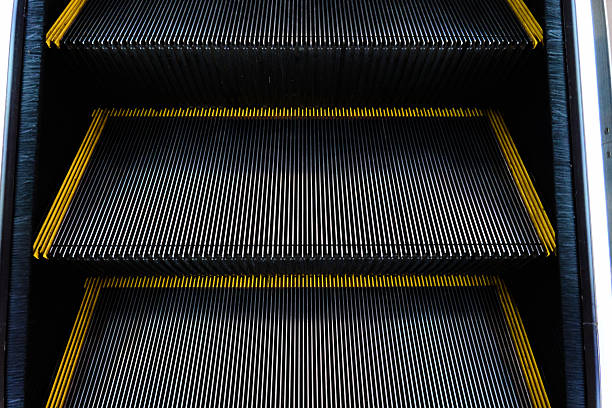 istock Close-up of escalator steps showing intricate design and structure 2217495057