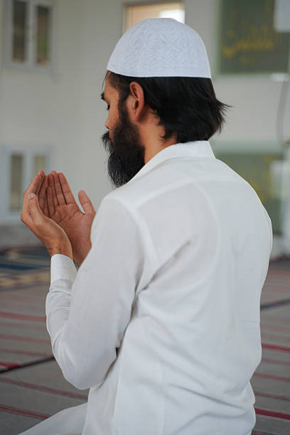 istock Muslim man praying. Religious devotion, Islamic faith, spirituality. 2217495455