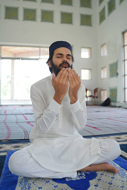 istock Man praying. Muslim prayer, dua, faith, Islam, worship, religious devotion. 2217496567
