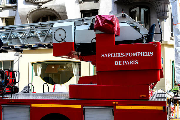 Fire engine and fire fighters at the scene of a fire in an apartment building in the city center of Zwolle.
