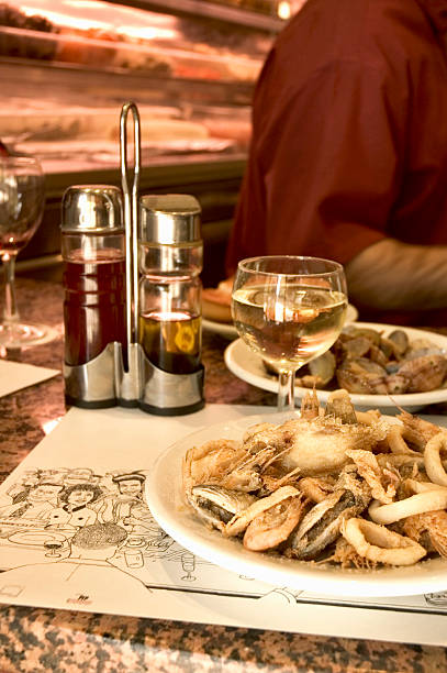 Seafood tapas and white wine from a bar in Barcelona. Nikon D70