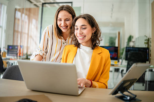 istock Young businesswomen collaborating and sharing ideas in a modern office environment 2217500995