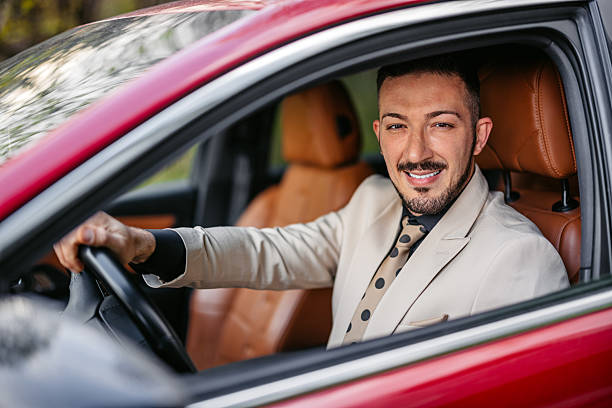 istock Mid-Adult Businessman Inside The Car 2217501498