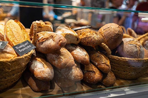 istock Assorted bread arranged on tray selling at bakery shop. Morning breakfast with fresh breads 2217501915