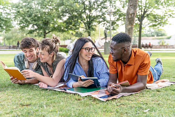 istock University students studying together lying on grass in park 2217503352
