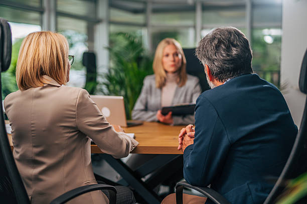 istock Business people sitting at table having a meeting 2217503985