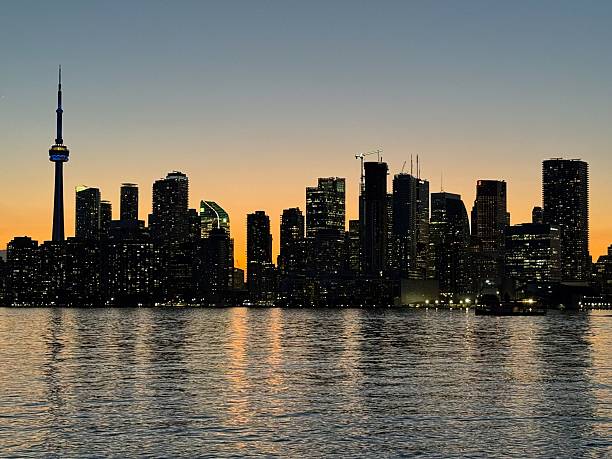 istock Toronto Skyline at Sunset with Reflections on Lake Ontario 2217504072