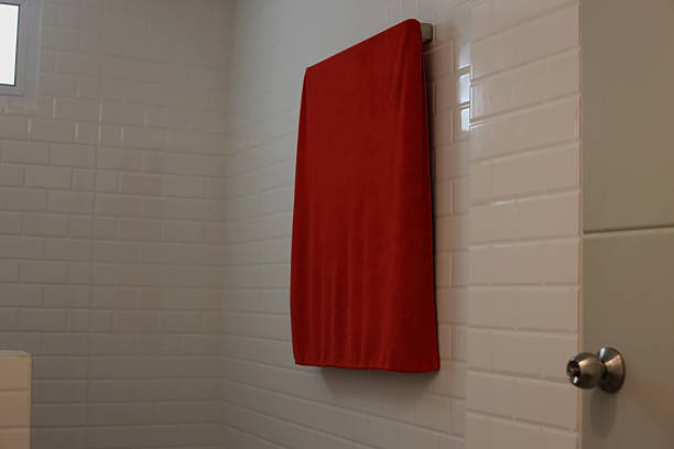istock Red Towel on White Subway Tile Wall 2217505627