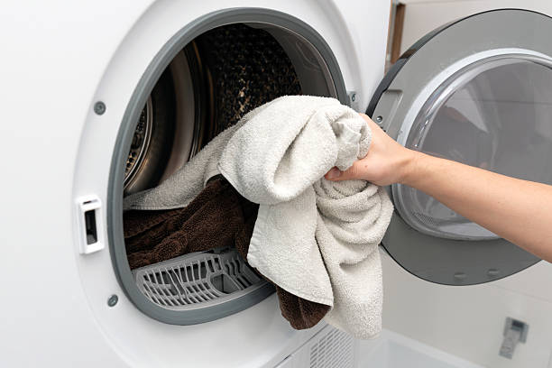 istock Using washing machine at home, household chores 2217506543