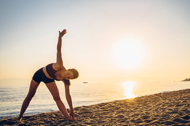 istock Woman exercising on the sea 2217507812