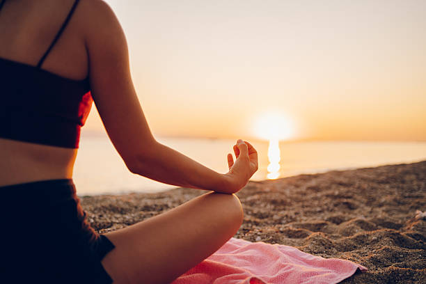 istock Woman exercising on the sea 2217508555