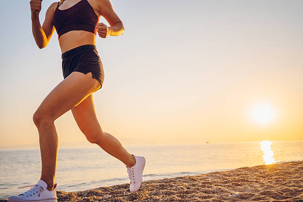 istock Woman exercising on the sea 2217508821
