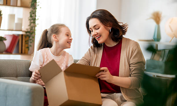 istock Mother and daughter are unpacking cardboard 2217509931