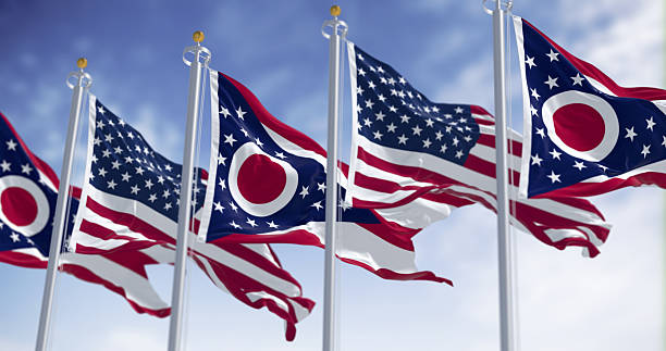 istock Ohio and national US flags waving in the wind on a clear day 2217511530