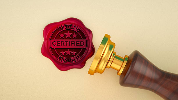 A shiny red wax Seal - Stamp, embossed with the word \