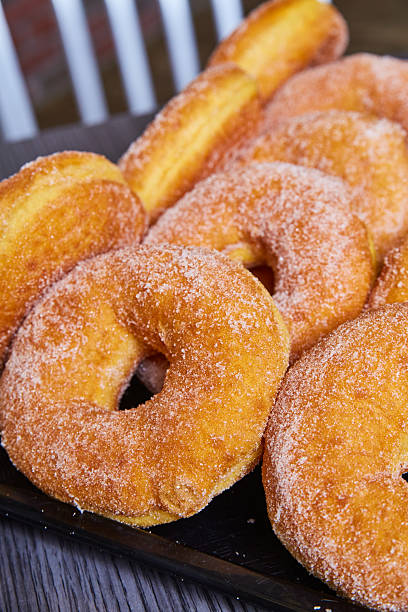 istock Freshly Baked Sugar-Coated Donuts Close-Up Perspective 2217512941
